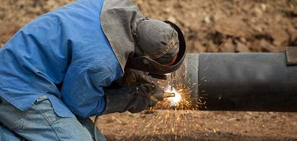Male Welder Wearing Protective Gear — Structural Steel Fabricators in Brisbane, QLD
