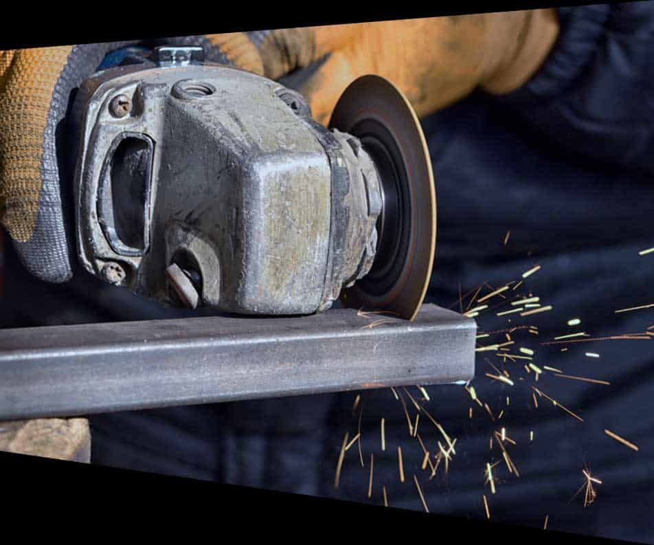 Cutting Metal with Angle Grinder — Structural Steel Fabricators in Rosemount, QLD