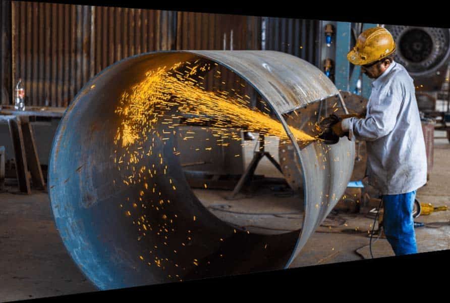 Man Cutting Big Steel Pipe — Structural Steel Fabricators in Rosemount, QLD