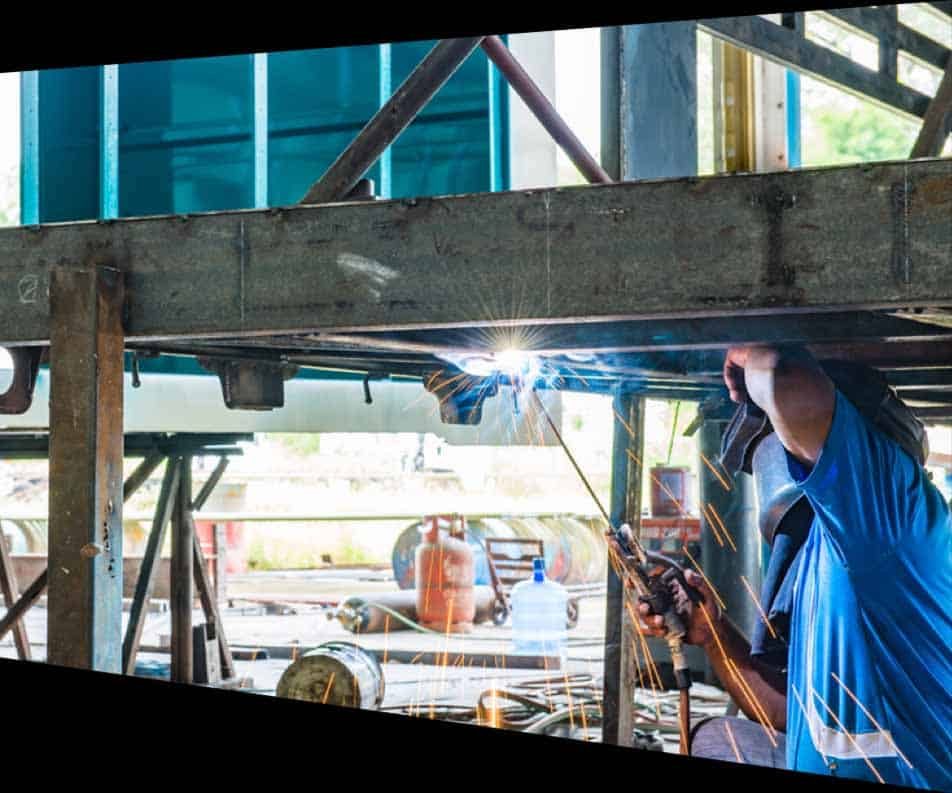 Man Wearing Welding Helmet Doing Metal Work — Structural Steel Fabricators in Sunshine Coast, QLD