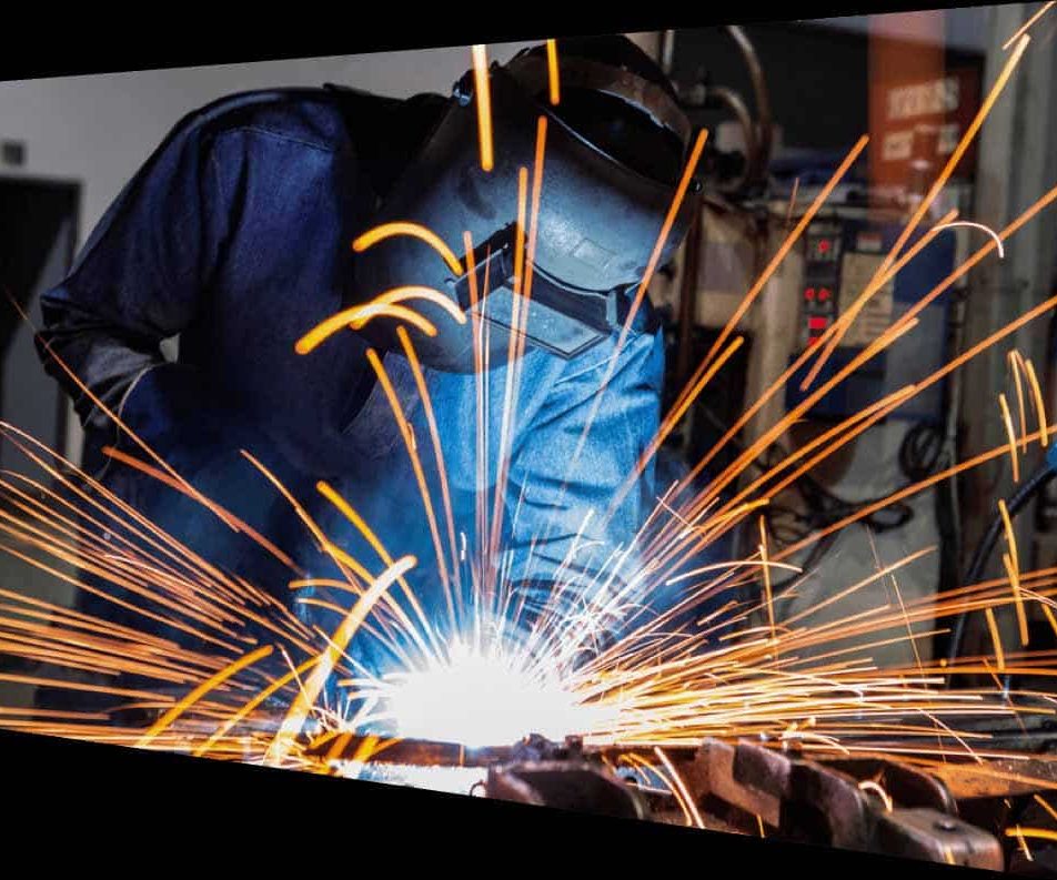 Welder Welding Metal Part — Structural Steel Fabricators in Rosemount, QLD