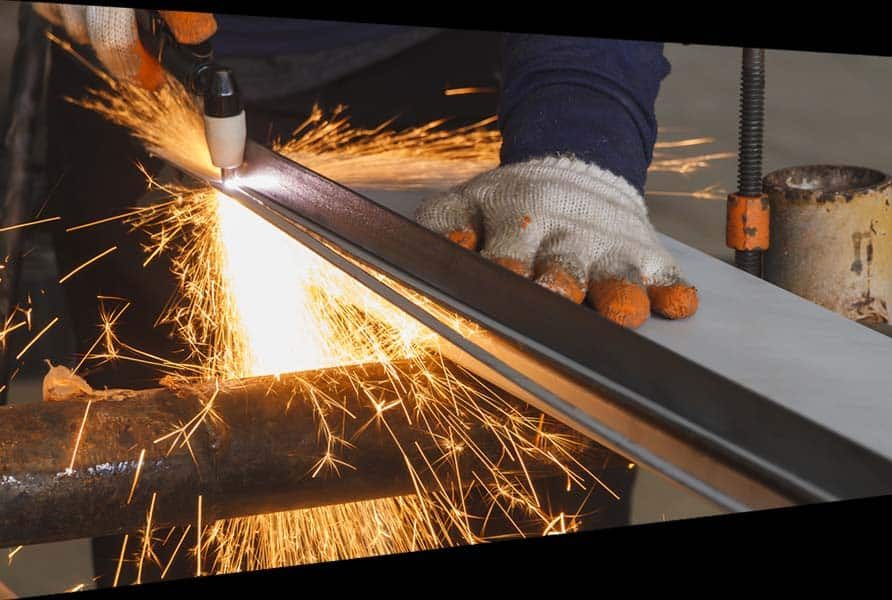 Worker Cutting the Steel — Structural Steel Fabricators in Gympie, QLD