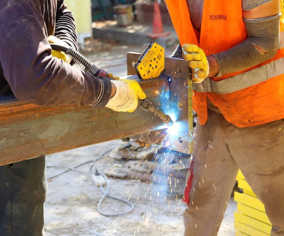 Workers Using A Welding Machine — Steel Fabricators on Western Australia